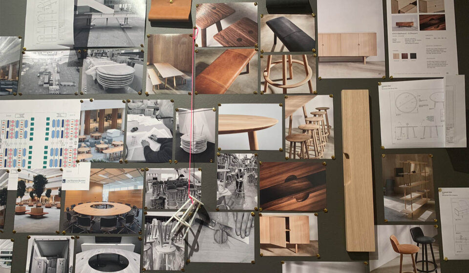 A collage of various design images and sketches pinned on a dark wall, showcasing furniture concepts, tables, and seating arrangements, alongside design plans and material samples.