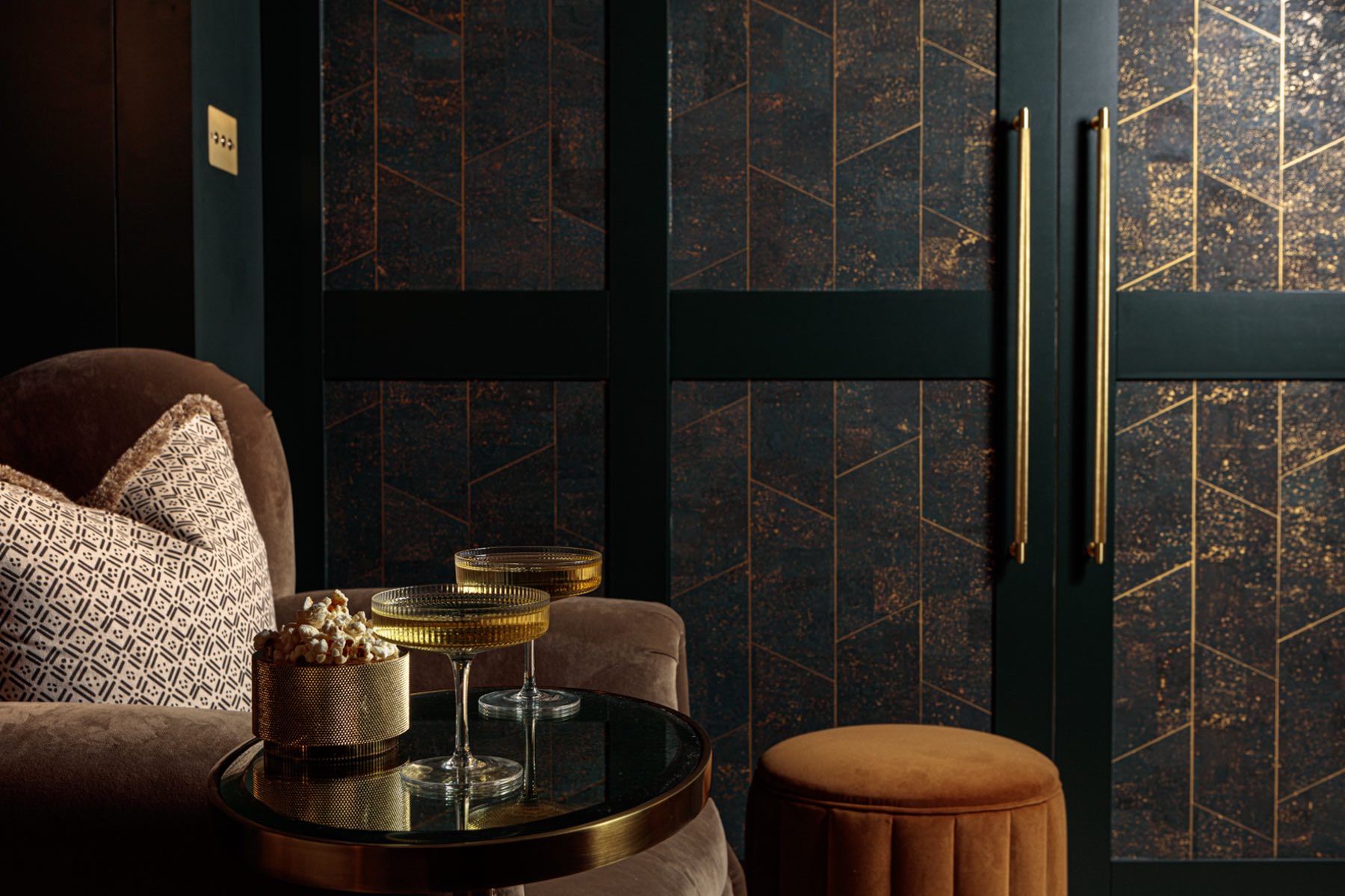 Dark tones velvet cinema room with luxurious armchairs and cocktail table