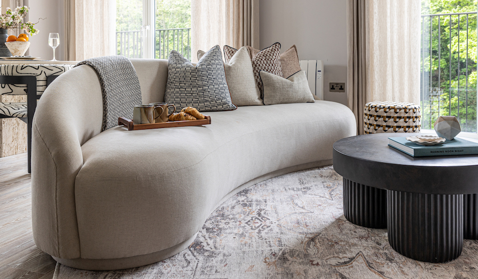 urban contemporary bespoke curved sofa upholstered by our trusted upholsterers in neutral tones and natural materials