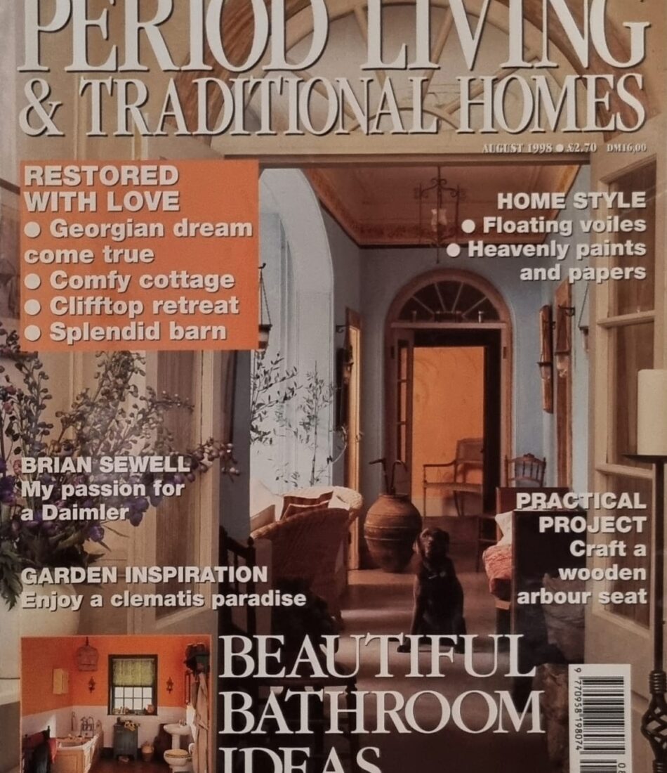 A magazine cover features elegant interior designs and home inspiration. The headline promotes "Beautiful Bathroom Ideas," highlighting various styles and projects, with a warm, inviting atmosphere depicted in the imagery.