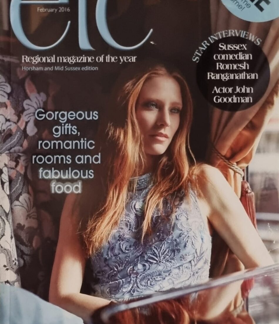A fashion magazine cover features a young woman with long hair, wearing a stylish dress, sitting elegantly near a window. Text highlights themes of gifts, rooms, and food.