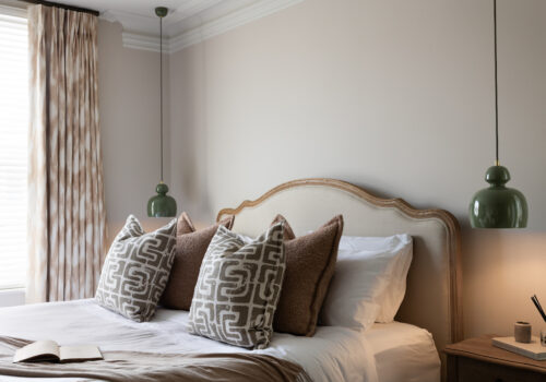 Contemporary Bedroom Designed with Bespoke headboard and Lighting Design by Pfeiffer Design. Neutral colour palette with warmth