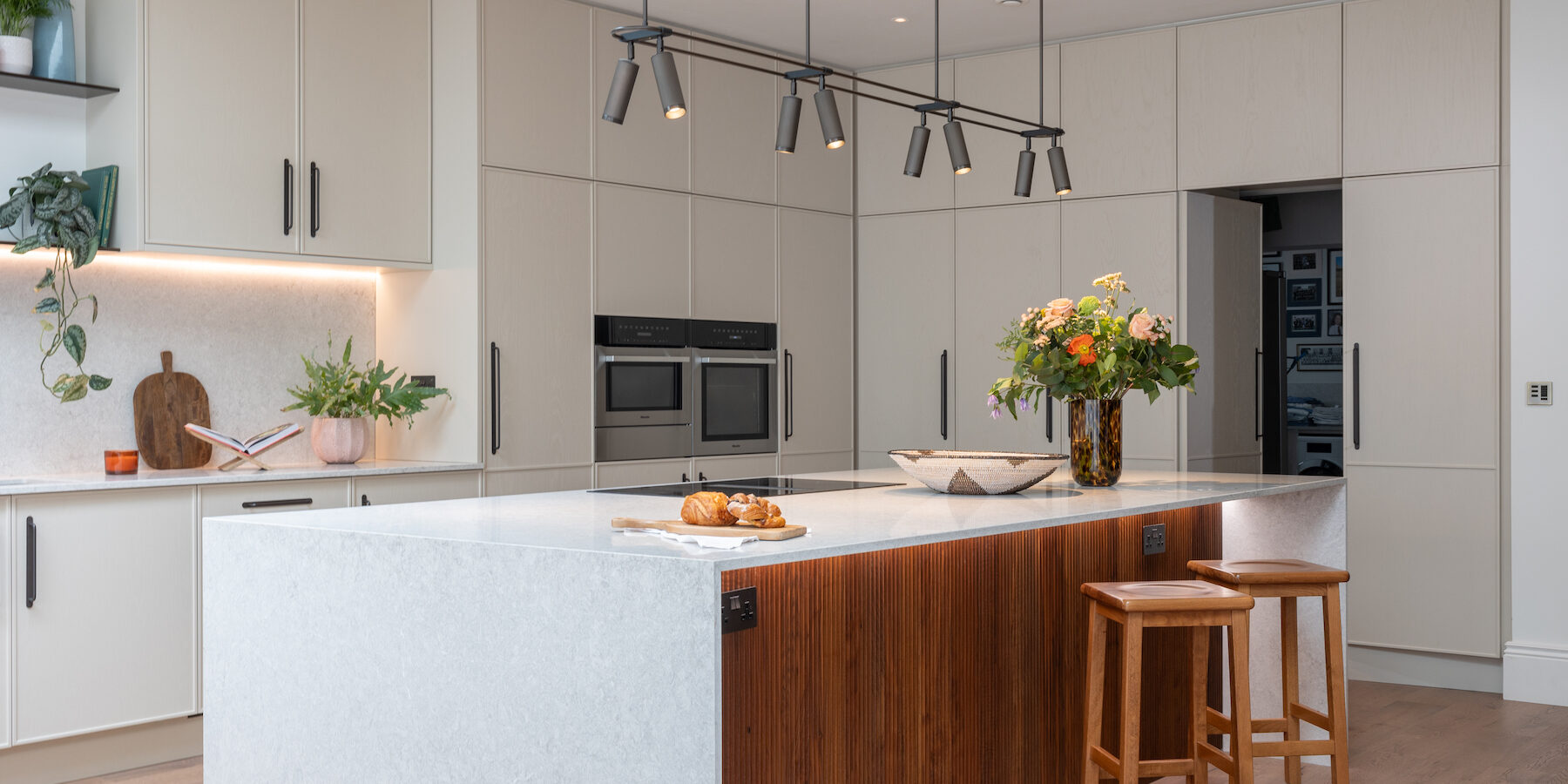 Contemporary Kitchen Designed Bespoke by Pfeiffer Design. Neutral colour palette with warm lighting design