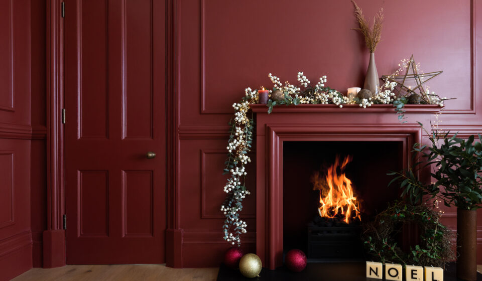 Deep Red Room with Fireplace and Christmas Decorations