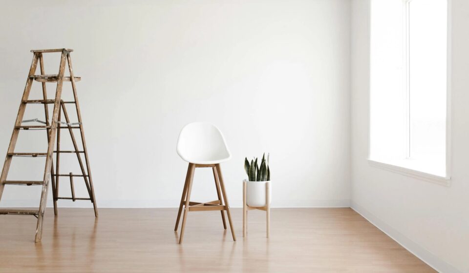 basic interior white walls with ladder and white chair