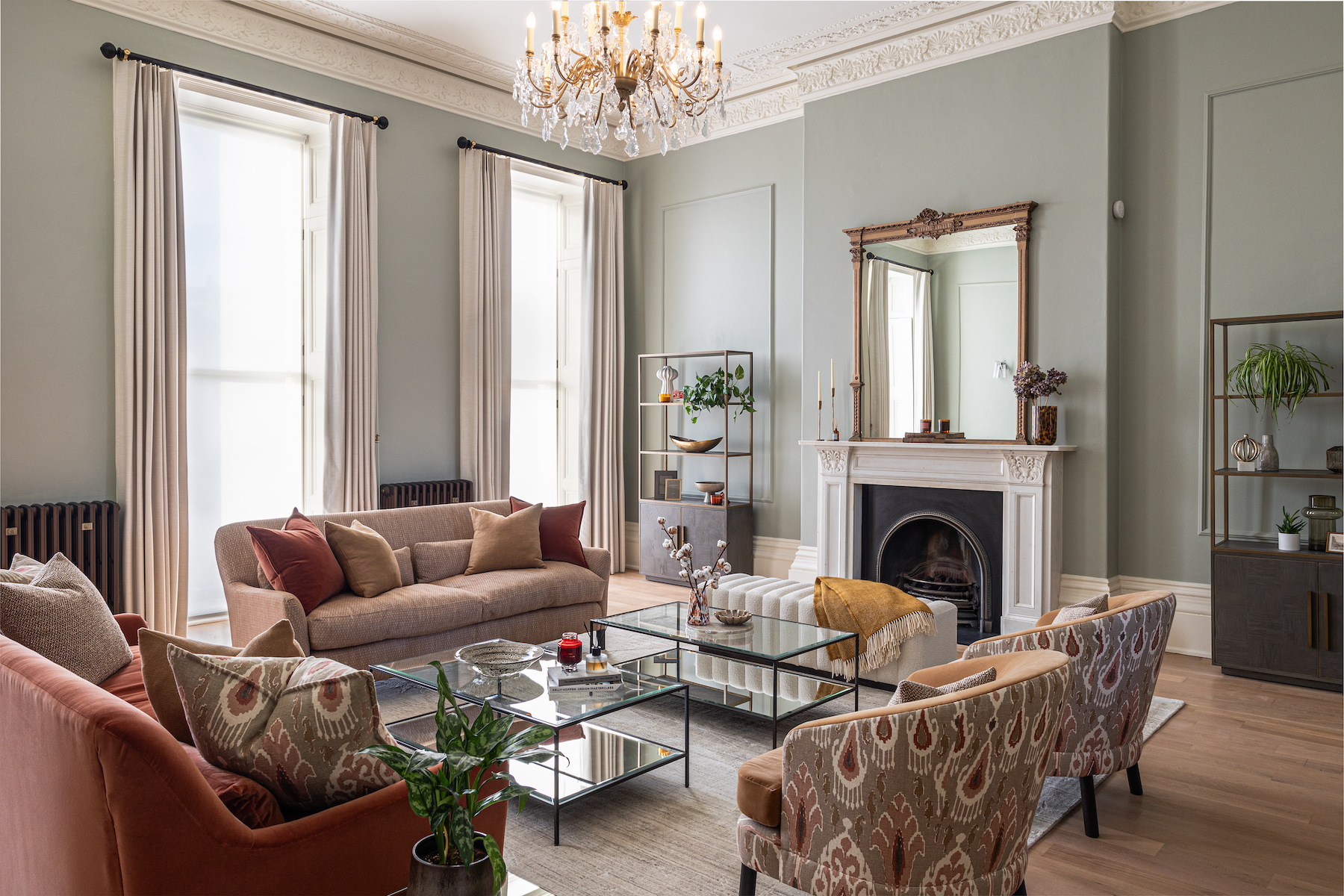 Period property showcasing living room design with colourful fabrics, high ceilings and chandelier