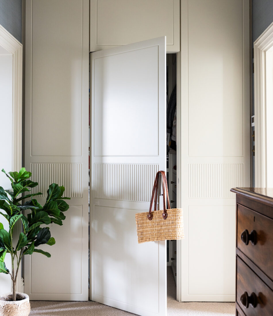 Bespoke joinery in principal dressing room, tall ceilings, fluted detail