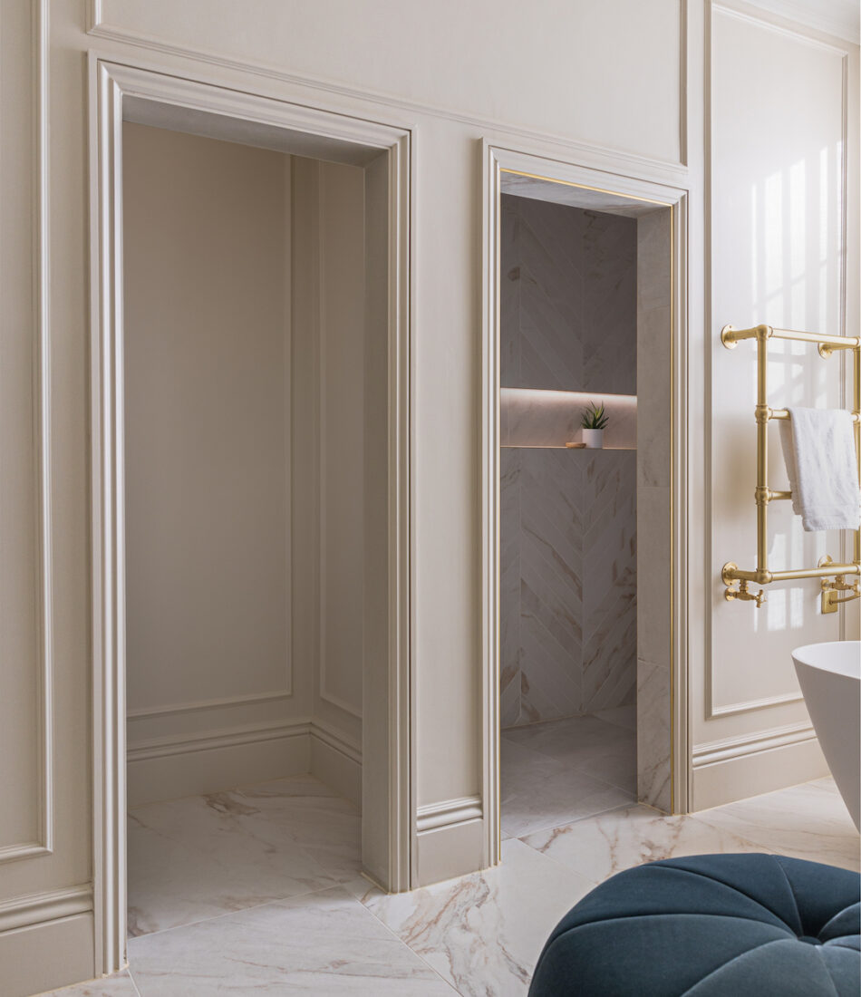 Panelled walls and doorways with neutral paint colour drenching door frames and skirting