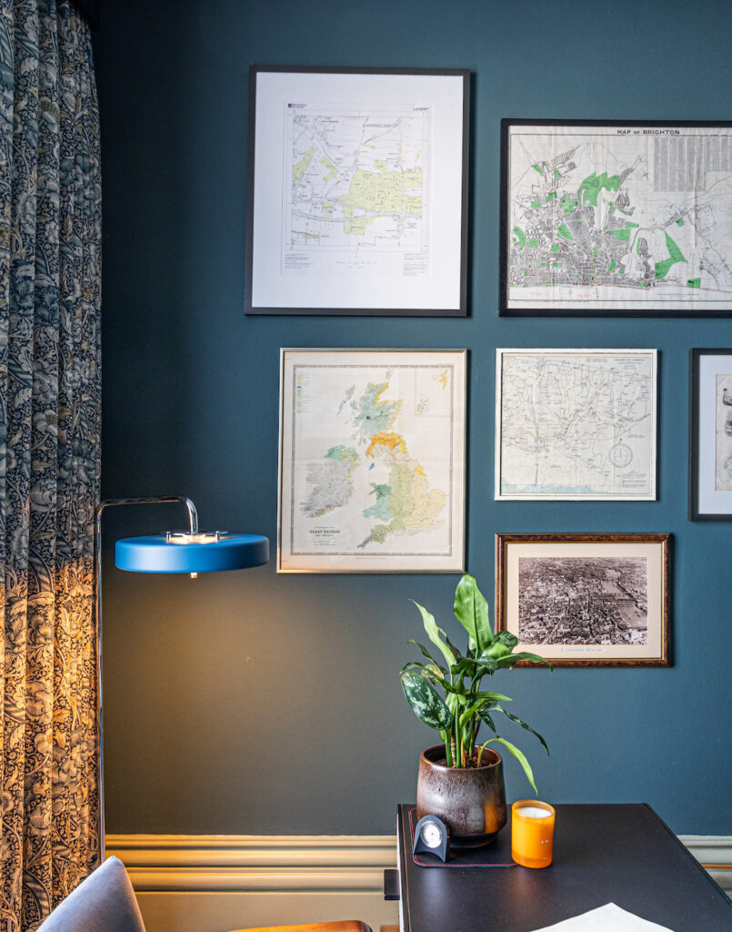 Study, Desk, Library space with navy walls and blue, orange pops of colour, patterned curtains and framed collage of maps
