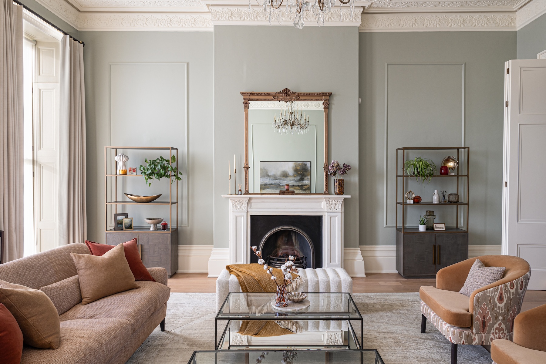 Regency Townhouse Lounge Living Room Interior Design with red, beige, warm patterns and yellow cushions