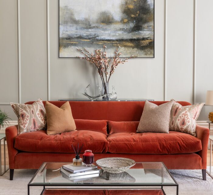 Colourful living room interior design with bespoke made sofa in rusty red