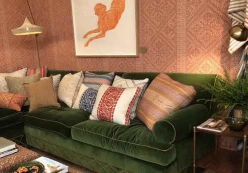 Green Sofa with Pink Wallpaper