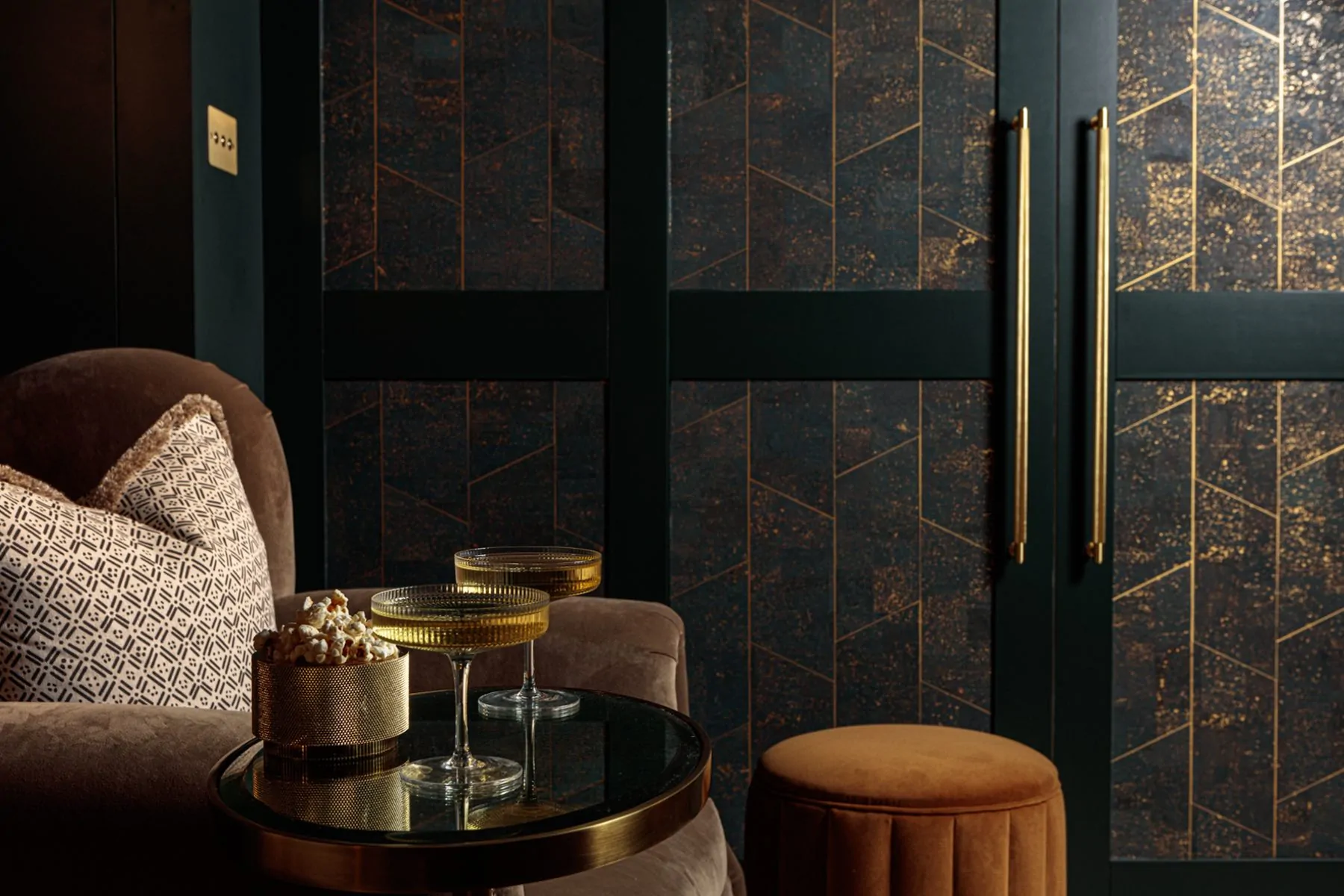 Dark tones velvet cinema room with luxurious armchairs and cocktail table