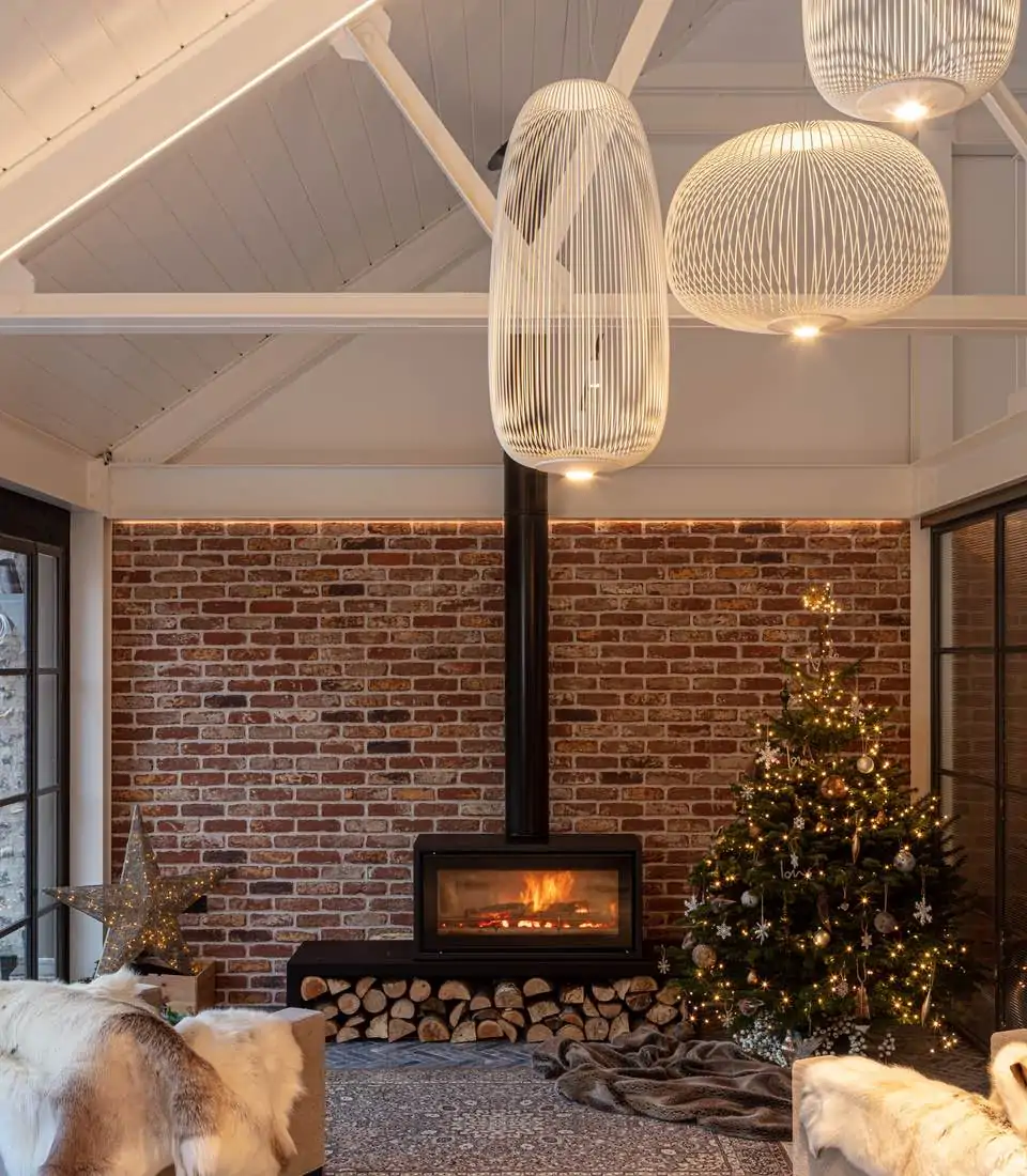 Log burner, exposed brick wall and unique lampshades