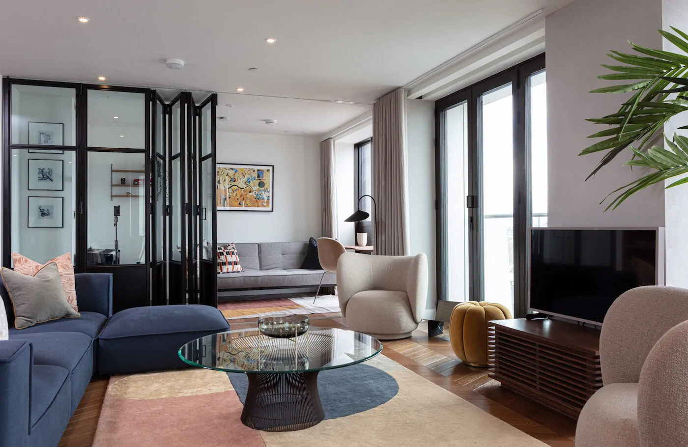 London Luxury Apartment Living Room with Black and Glass Panelled Room Divider