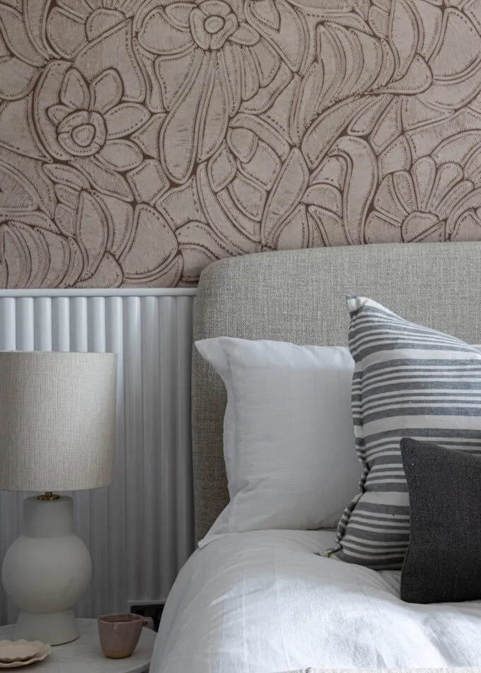 urban contemporary bespoke bedroom design with bespoke headboard, bespoke fluted wall joinery and rope texture fabric wallcoverings