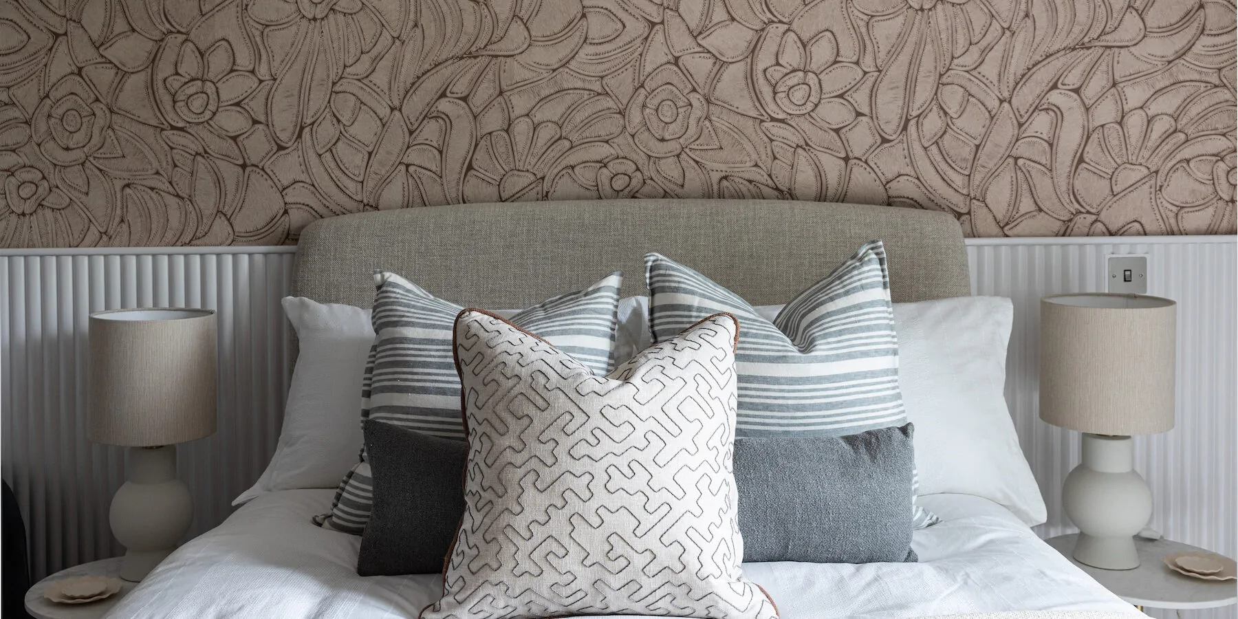 urban contemporary bespoke bedroom design with bespoke headboard, bespoke fluted wall joinery and rope texture fabric wallcoverings