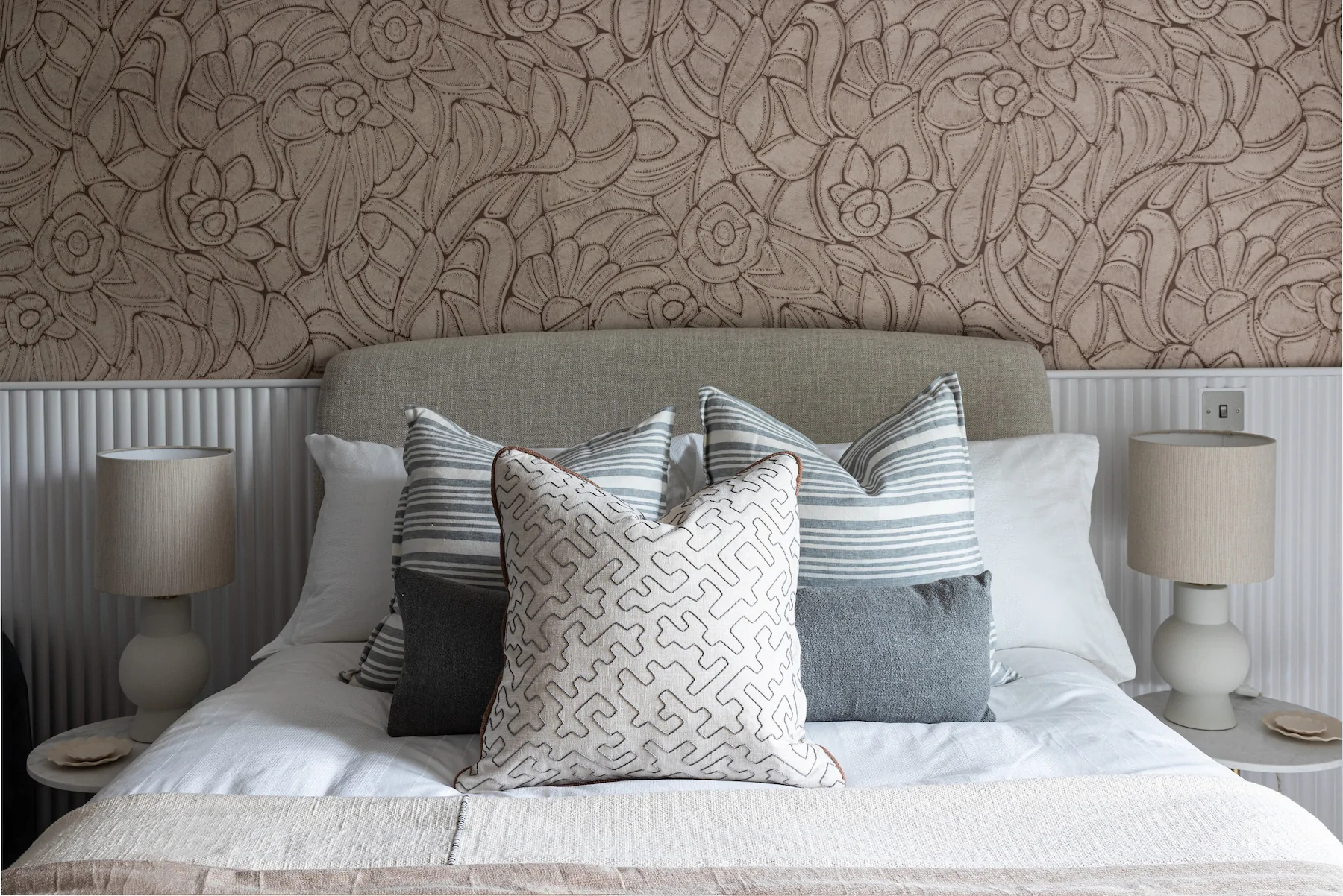urban contemporary bespoke bedroom design with bespoke headboard, bespoke fluted wall joinery and rope texture fabric wallcoverings