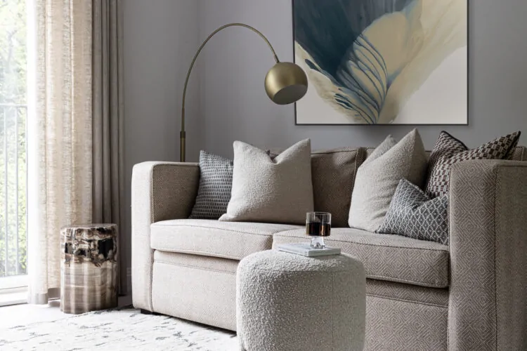 urban contemporary bespoke upholstered sofa bed with bespoke soft furnishings, footstools and petrified wood plinth