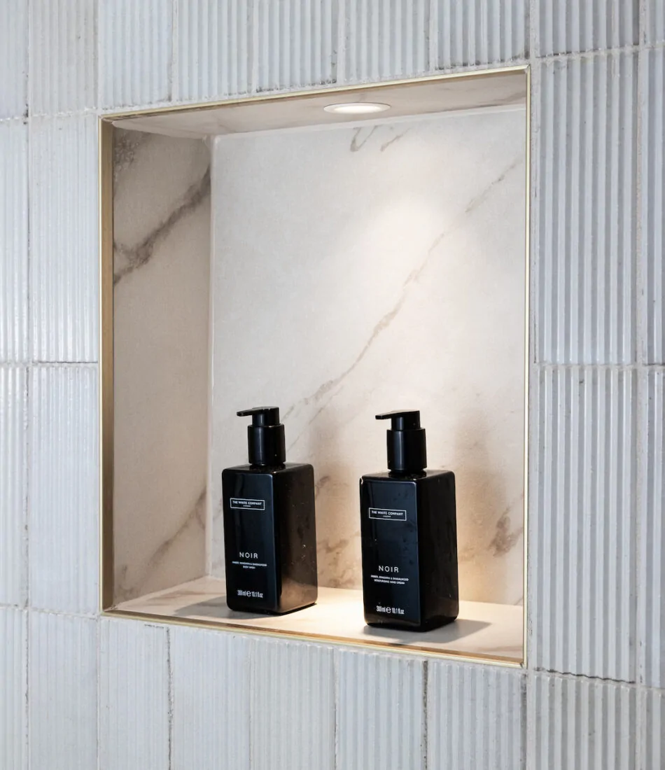 cricket paradise in Sussex hove. new bathroom design created with our internal layout alteration services. Niche lighting.