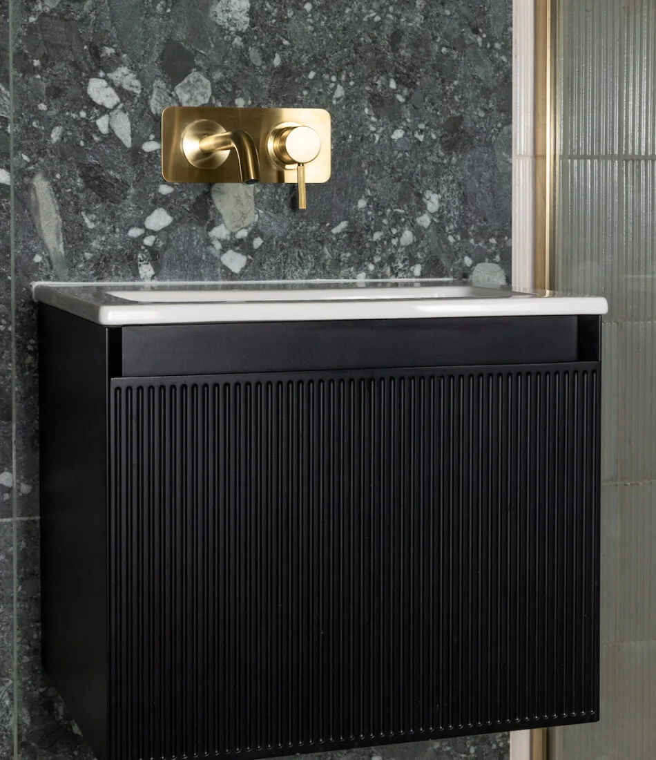 cricket paradise in Sussex hove. new bathroom design created with our internal layout alteration services. Stone work basin