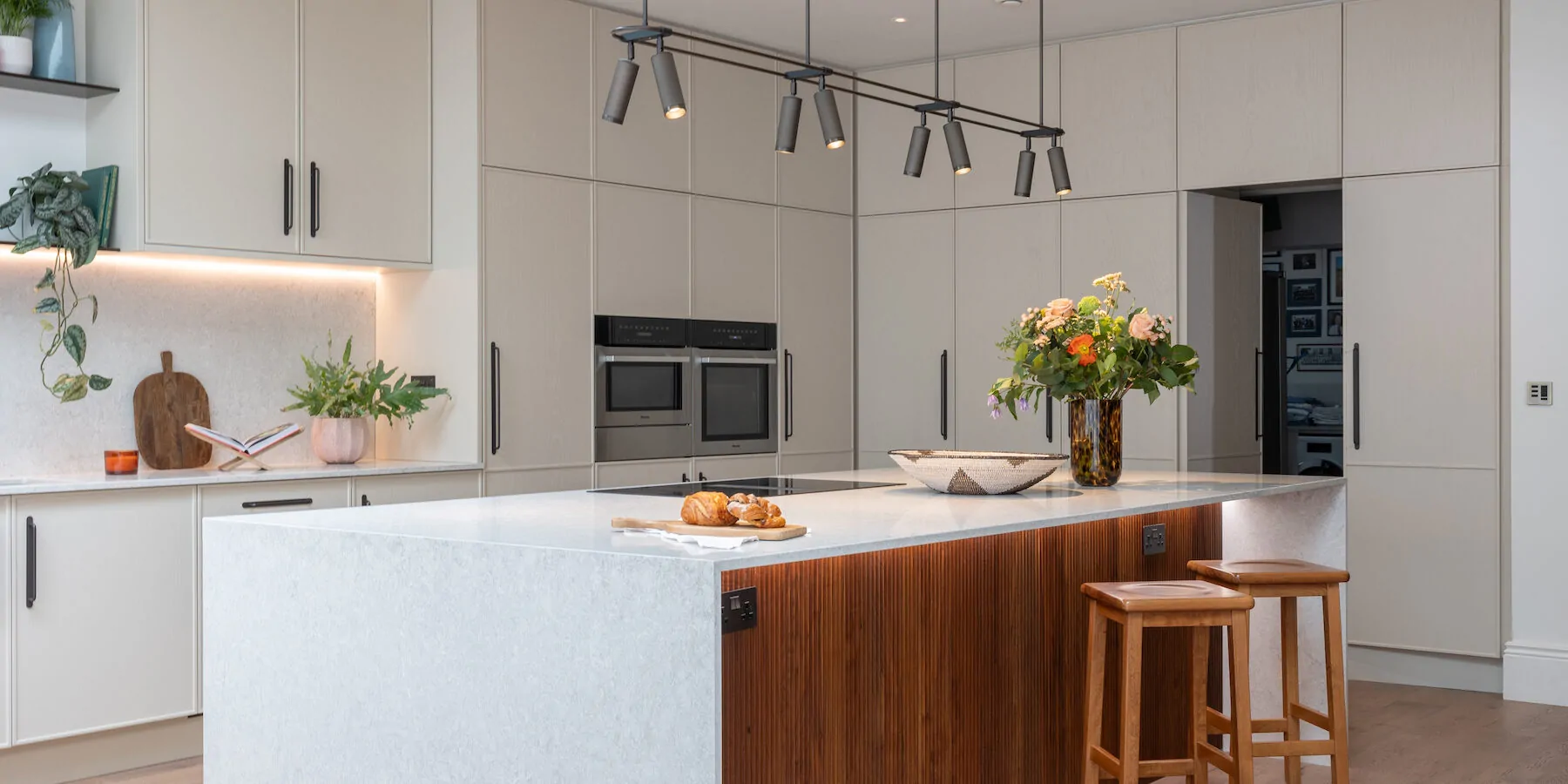 Contemporary Kitchen Designed Bespoke by Pfeiffer Design. Neutral colour palette with warm lighting design