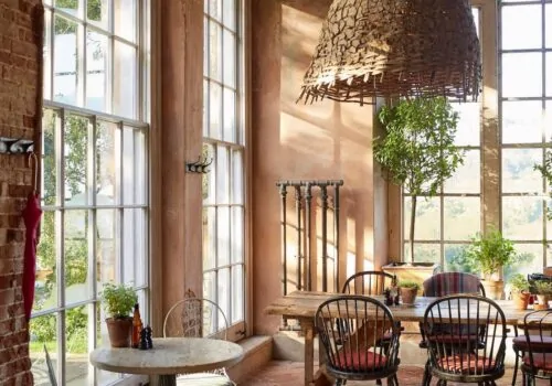 terracotta tiles and lime wash plaster walls in organic hospitality design