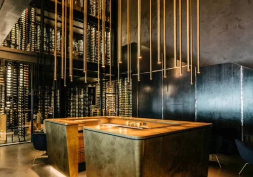 Hotel / Restaurant design with brushed gold reception desk and lighting