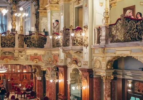 traditional cafe interior Budapest gold gilding details and marble