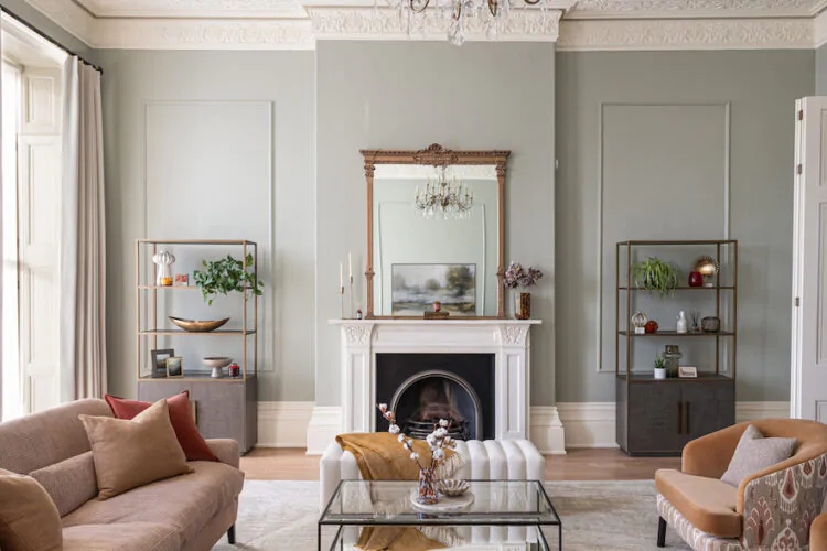 Regency Townhouse Lounge Living Room Interior Design with pops of red, yellow, blue, green warm tones and tall ceilings