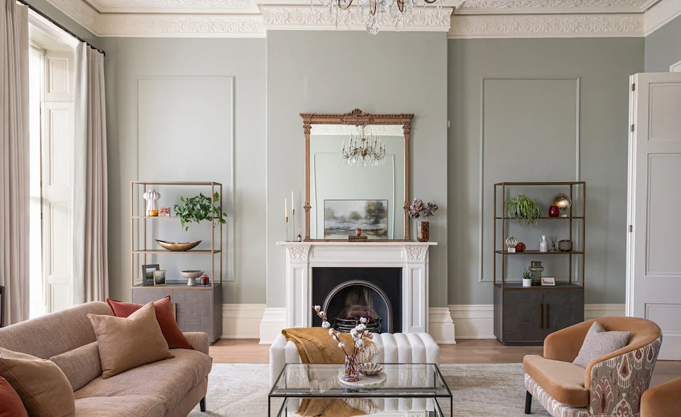 Regency Townhouse Lounge Living Room Interior Design with pops of red, yellow, blue, green warm tones and tall ceilings