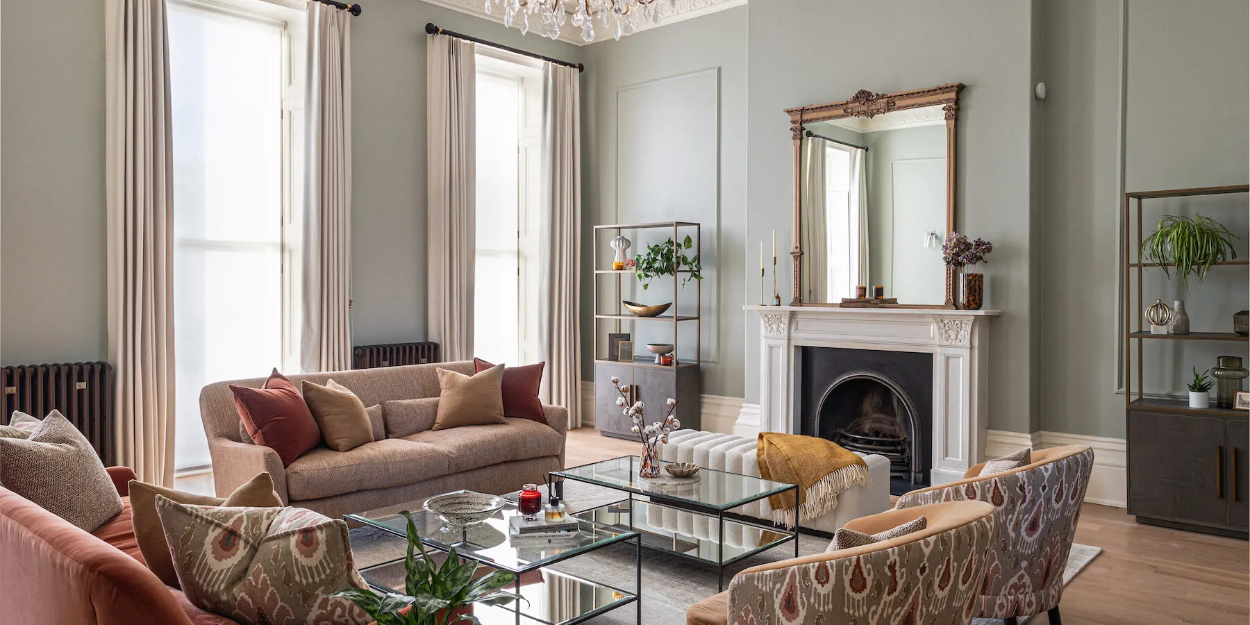 Period property showcasing living room design with colourful fabrics, high ceilings and chandelier