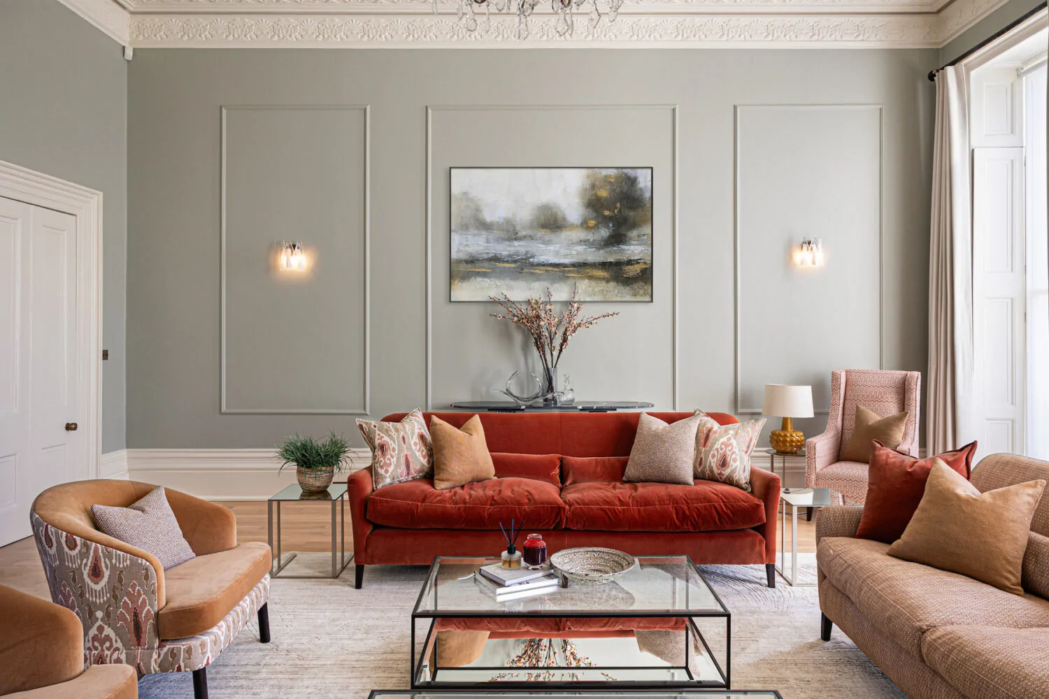 Regency Townhouse Lounge Living Room Interior Design with red, beige, warm patterns and yellow cushions