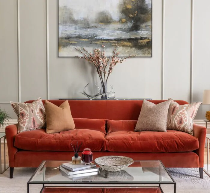 Colourful living room interior design with bespoke made sofa in rusty red
