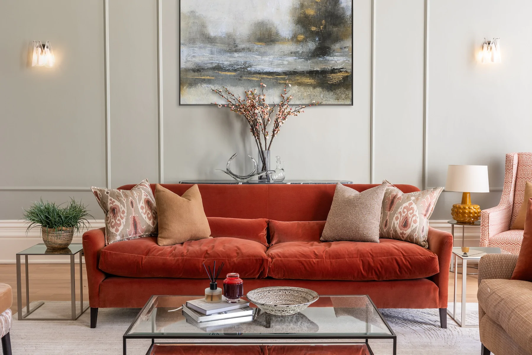 Colourful living room interior design with bespoke made sofa in rusty red